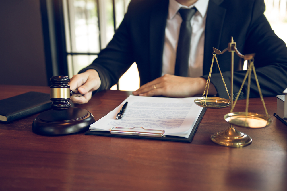 lawyer with paperwork and gavel