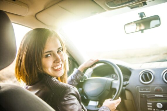 woman smiling in car