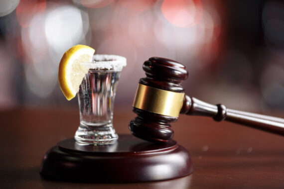 shot of tequila next to gavel