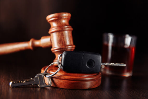 Images of a judge's gavel, car keys and a drink
